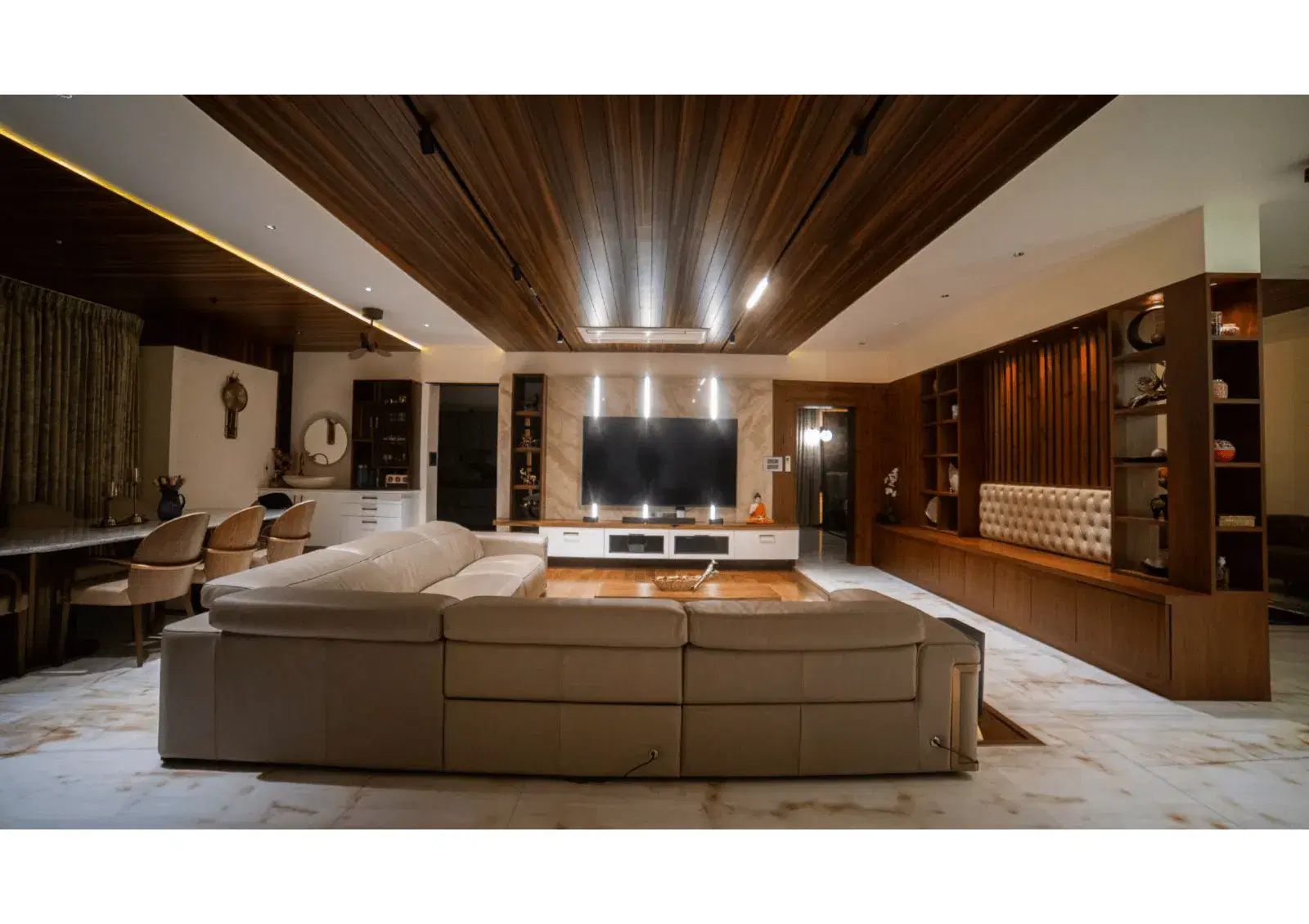 Warm living room with wood ceiling and cozy seating