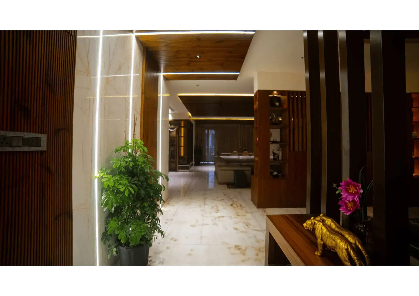 Elegant villa entryway with warm wood paneling